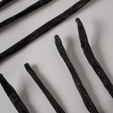 Vanillya Vanille Bourbon 2 kg artisan vanilla beans in a sealed bag, showcasing rich, dark brown color and texture.